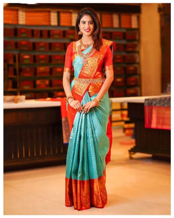 Enigmatic Turquoise Soft Silk Saree with Propinquity Blouse Piece