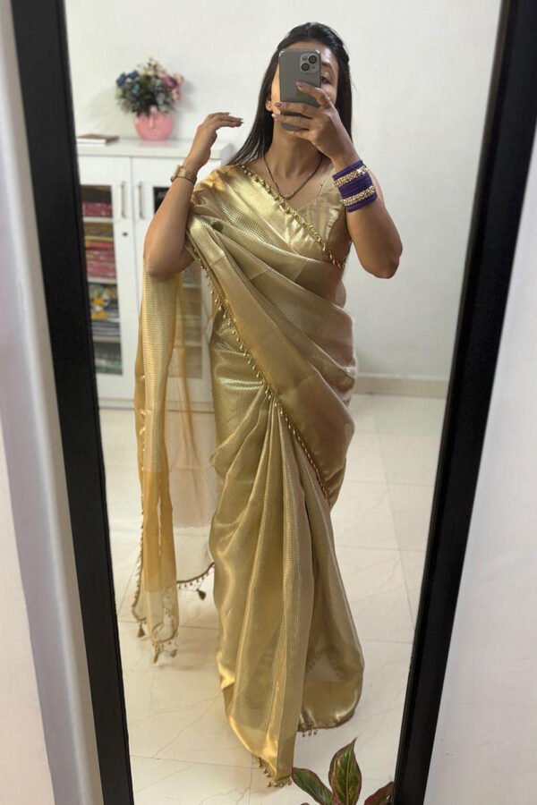 Dazzling Golden Soft Tissue Silk Saree With Zephyr Blouse Piece